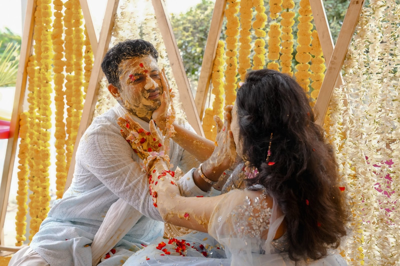 Bride and groom smiling during a candid wedding photography session by Vevah Wedding